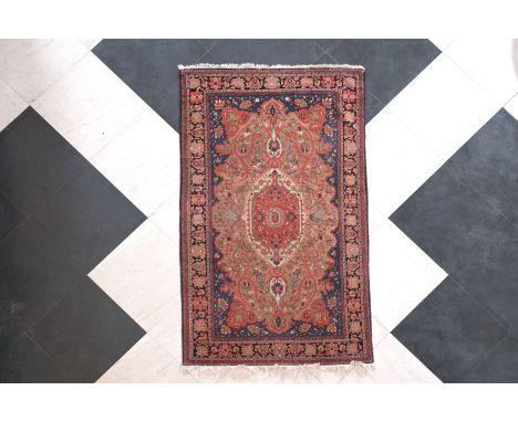 A Persian Ferahan rug with floral design, wool on cotton, first half 20th C.212 x 128 cm