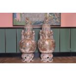 A pair of Japanese Satsuma 'Immortals' vases and covers on stands, Meiji, 19th C.