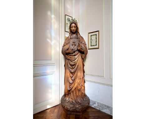 A large carved oak sculpture 'The Immaculate Heart of Mary', probably Belgium, monogram D.B. or C.B., dated 1906H 164 - 158 c