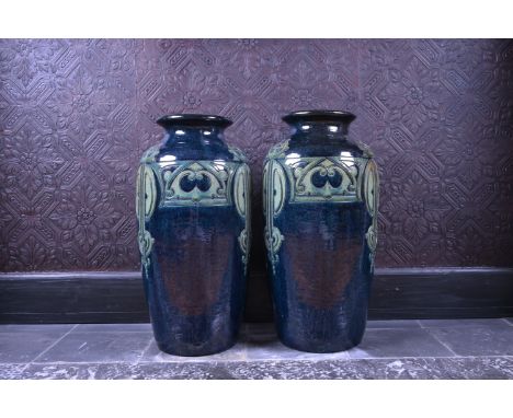 A pair of polychrome Flemish pottery Art Deco 'geometric' vases, probably Laigneil, Kortrijk, first half 20th C.H 47,5 cm  Pi
