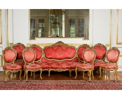 A French 7-piece crimson damask upholstered gilt wooden Louis XV style salon suite comprising a canape, a pair of armchairs a