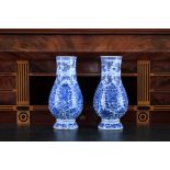 A pair of Chinese blue and white vases with floral design, Kangxi