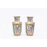 A pair of Chinese Canton famille rose vases with palace scenes, 19th C.