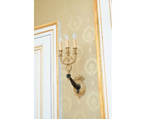 A pair of French gilt and patinated bronze Neoclassical three-light wall appliques, late 19th C.H 60 - L 22 - D 22 cm Drilled