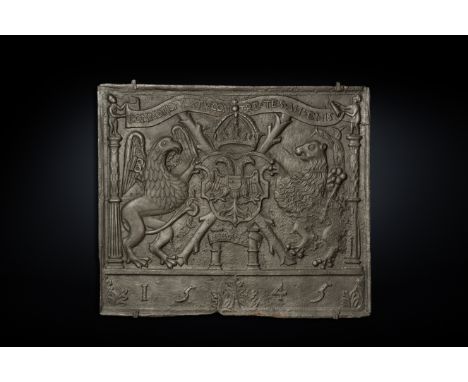 A large cast iron Charles V armorial fireplace plaque dated 1545110 x 93 cm  This plaque presents a rich heraldic ornamentati