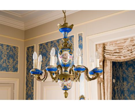 A French gold layered blue ground Sevres style bronze chandelier with a pair of accompanying two-light wall appliques with pu