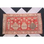 A Samarkand rug with Chinese inspired flower vases, wool on cotton, 20th C.