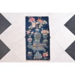 A Chinese Pao Tao rug with antiquities design, 20th C.
