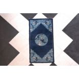 A Chinese blue and white 'dragon' carpet, 20th C.