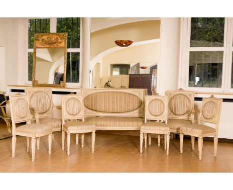 A French 7-piece gilt and patinated wooden Louis XVI style salon suite comprising a canape, a pair of armchairs and four chai