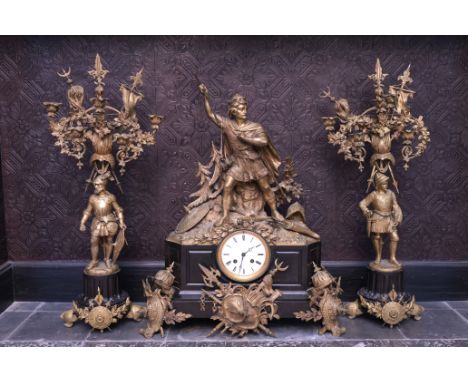 A large three-piece gilt bronze and black marble clock garniture depicting the French king Louis VII, Vincenti & Cie, 19th C.