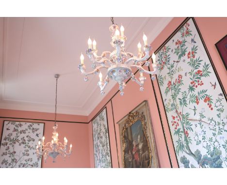 A pair of Italian twelve-light polychrome and gilt biscuit chandeliers with floral relief design, Capodimonte mark, 20th C.H 