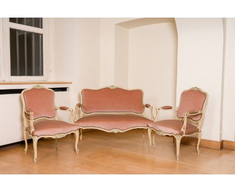 A gilt and patinated wooden Louis XV style and pink velvet upholstered salon set comprising a sofa and two armchairs, 20th C.
