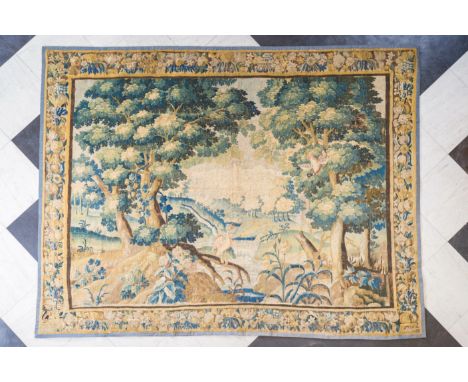 A Flemish wall tapestry with birds in a wooded landscape, 17th C.350,5 x 267,5 cm  The composition bears similarities to tape