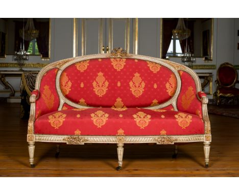 A French Louis XVI style gilt and patinated wooden sofa with empire style fabric upholstery, 19th C.H 109 - L 159 - D 64 cm