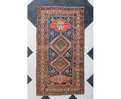 A Caucasian Shirvan wool carpet with floral design and geometric motifs, first half 20th C.263 x 144,5 cm