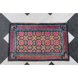 A Chinese Pao Tao rug with floral design, 20th C.