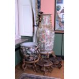 A Chinese famille rose jardiniere with birds among blossoming branches and a Canton vase with four w