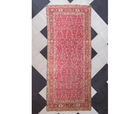 A Caucasian rug with floral design, wool on cotton, first half 20th C.485 x 201,5 cm