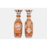 A pair of impressive Japanese Kutani iron-red, polychrome and gilt flared rim vases, Meiji, 19th C.