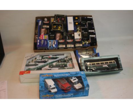 A COLLECTION OF BOXED DIECAST VEHICLES, to include Maisto, Chad Valley City Emergency Set, Ertl etc