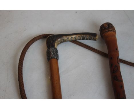 SWAINE &amp; CO. WHITE METAL MOUNTED RIDING CROP, along with an Oriental carved walking stick  (2)