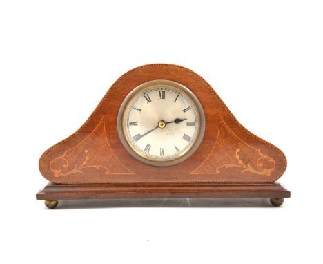 An Edwardian inlaid mahogany mantel clock, replaced quartz movement, ogee form, raised on bun feet, 17cm.