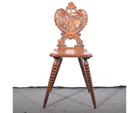 Edwardian oak hall chair, with a nautical theme, carved back with anchor, rigging, sails and leaping fish, bobbin-turned tape