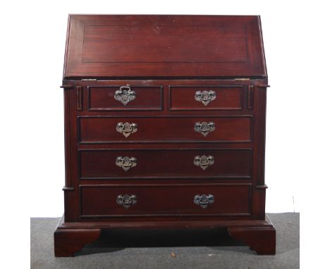 A George III style mahogany bureau, fall front above doors, flanked by fluted quarter columns, bracket feet, width 80cm, dept