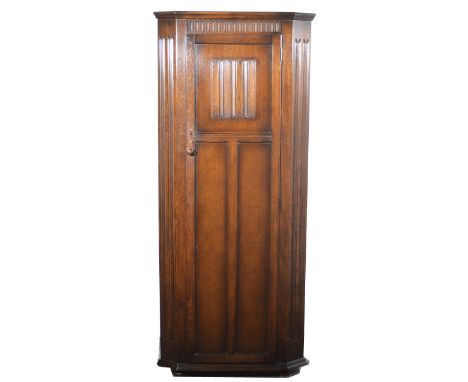 An oak hallway robe/ cupboard, circa 1930s, single panelled cupboard enclosing shelf above a rail, width 80cm, depth 41cm, he