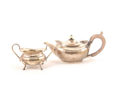 A silver bachelor's teapot by George Nathan &amp; Ridley Hayes, Chester 1907, plain oval polished form with egg bead border, 