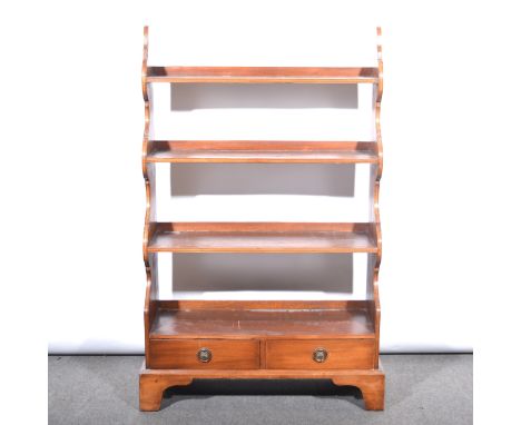 A mahogany open waterfall bookcase, of three shelves above two short drawers, bracket feet, width 79cm, depth 28cm, height 12