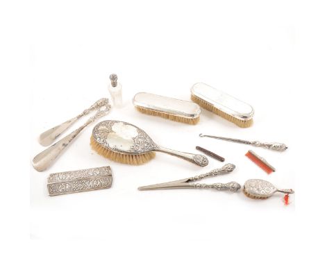 A silver-backed hairbrush by Williams (Birmingham) Ltd, Birmingham 1912, a pair of brushes by Deakin &amp; Francis Ltd, Birmi