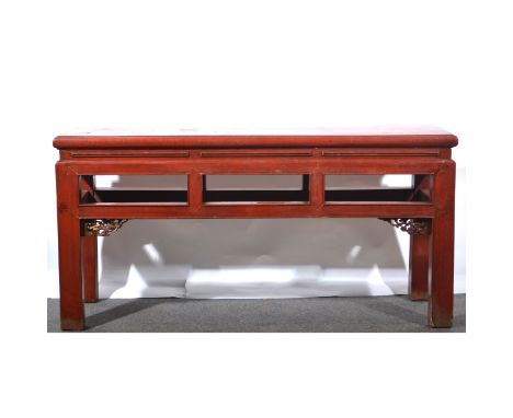 A Chinese painted hardwood low table, rectangular top, open panelled frieze, with carved and scroll brackets, length 104cm, d