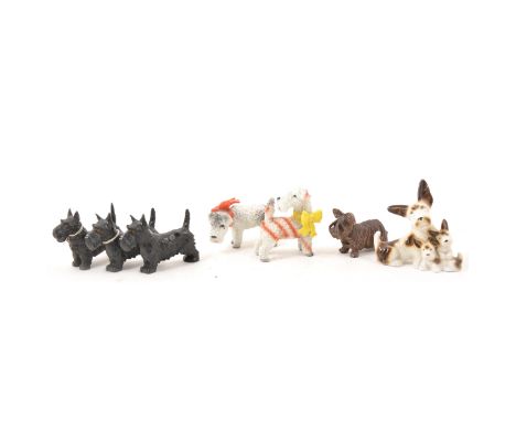 Scottie Dog ornaments. ceramic snowscene dogs, wooden, lead, two cards each with six buttons, other loose pressed glass butto