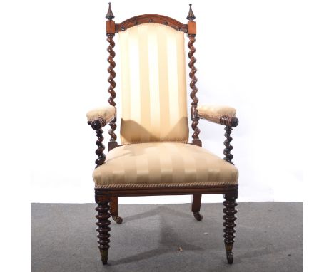 A Victorian rosewood armchair, barley twist uprights with fluted finials, bobbin turned arms and front supports, striped gold