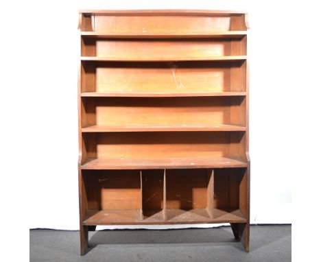 An oak open bookcase, six graduated shelves, the lower shelf with later divisions, width 122cm, depth 31cm, height 176cm.