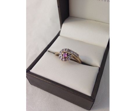 Hallmarked 9ct gold ladies dress ring set with a central pink sapphire surrounded by white, size approx N1/2, weight approx 3