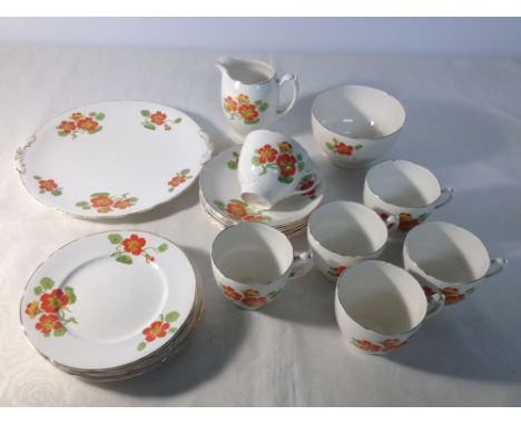 A Newhall 6 setting tea set c1930-50s decorated with orange flowers, comprising 6 cups & saucers, 6 tea plates, milk jug, sug