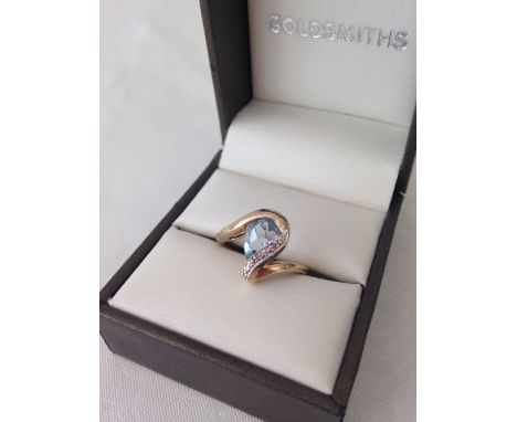 Unusual design blue topaz & diamond ladies ring. Large pearl cut stone approx 0.75ct. Hallmarked 9ct gold, size approx L, wei