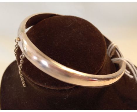 A 9ct gold Victorian smooth bangle with safety chain approx. 10.9g - not hallmarked, tests as 9ct.  