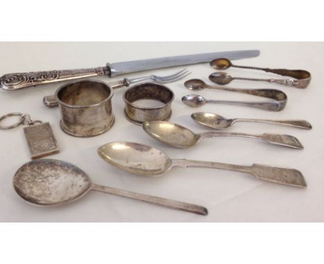 A quantity of HM silver items to include apostle sugar tongs & heavy napkin ring. Approx 200g total weight.  