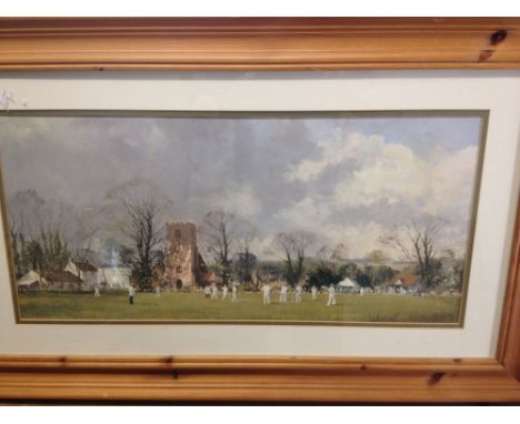 A pine framed & glazed print of a village cricket match. 51 x 83cm by Ray Perry.  