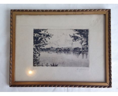 A framed & glazed continental block print of a lake & village signed by A. Gebhard. 24 x 31cm.  