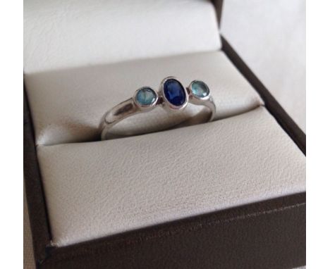 925 silver ring with central sapphire and 2 blue topaz stones, size O.  