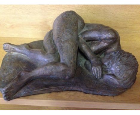A bronze resin sculpture of a girl sleeping by Marian Williams. 30cm long.  