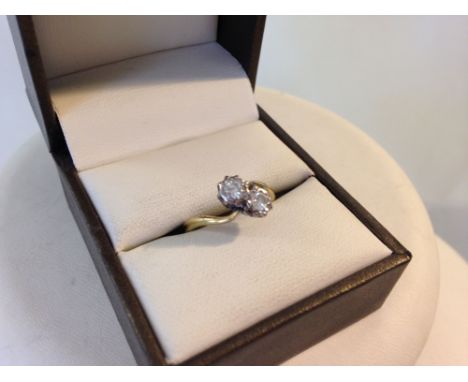 An 18ct gold & diamond ring set with 2 diamonds, each stone approx 0.2 carat. Size K.  