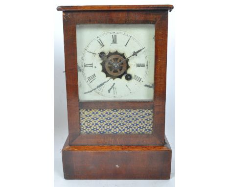 Mid 19th Century USA mahogany eight day alarm mantle clock. Of rectangular form with a flared top, glazed opening front with 