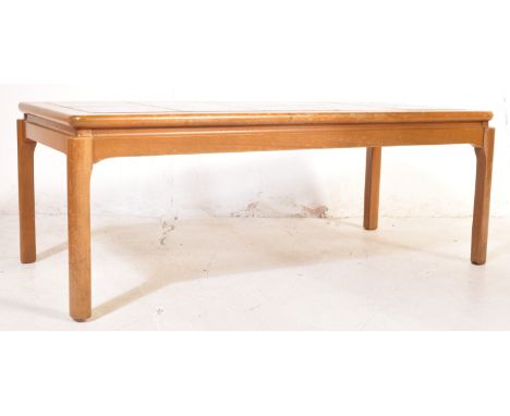 A retro vintage 20th century circa 1970s&nbsp;teak wood and tile top coffee table. The occasional table having a tile top wit