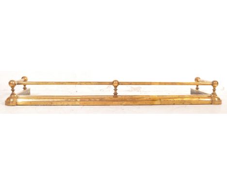 A Victorian 19th century brass fire guard / fender. Having railing &amp; finials, with columned railing. Measuring 14x151x43c